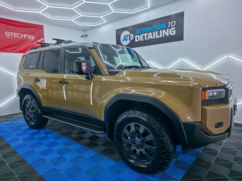 A freshly coated 4WD under the hexagon lights in the Attention To Detailing studio, South Nowra