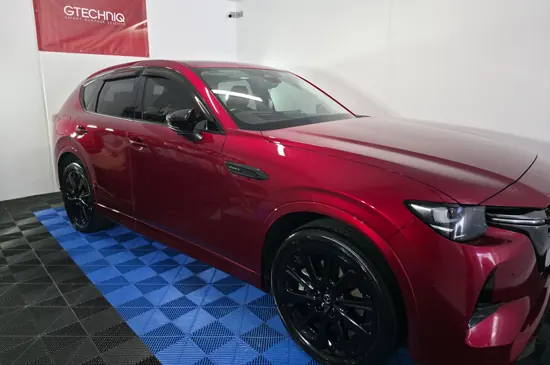 Deep red Mazda SUV after a paint enhancement